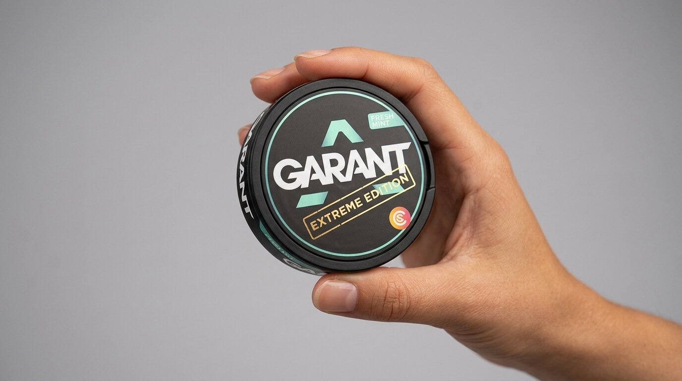Hand holding a nicotine pouch tin from D-LYT Vapes Kenya